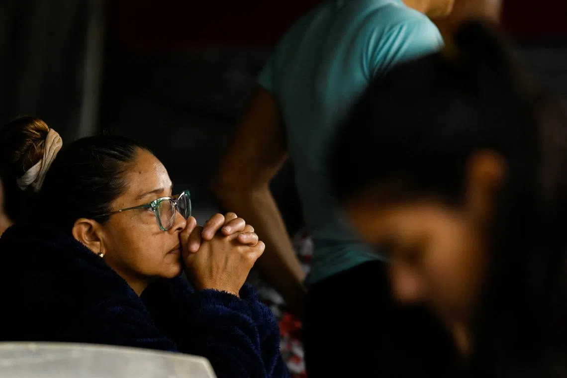 A family member of detainees waits outside El Rodeo jail, as Venezuela has freed Czech, Hungarian, Dutch and German citizens imprisoned in the country, part of a flow of prisoner releases, following the U.S. capture of Nicolas Maduro, in El Rodeo, Guatire, Venezuela, January 16, 2026. REUTERS/Maxwell Briceno