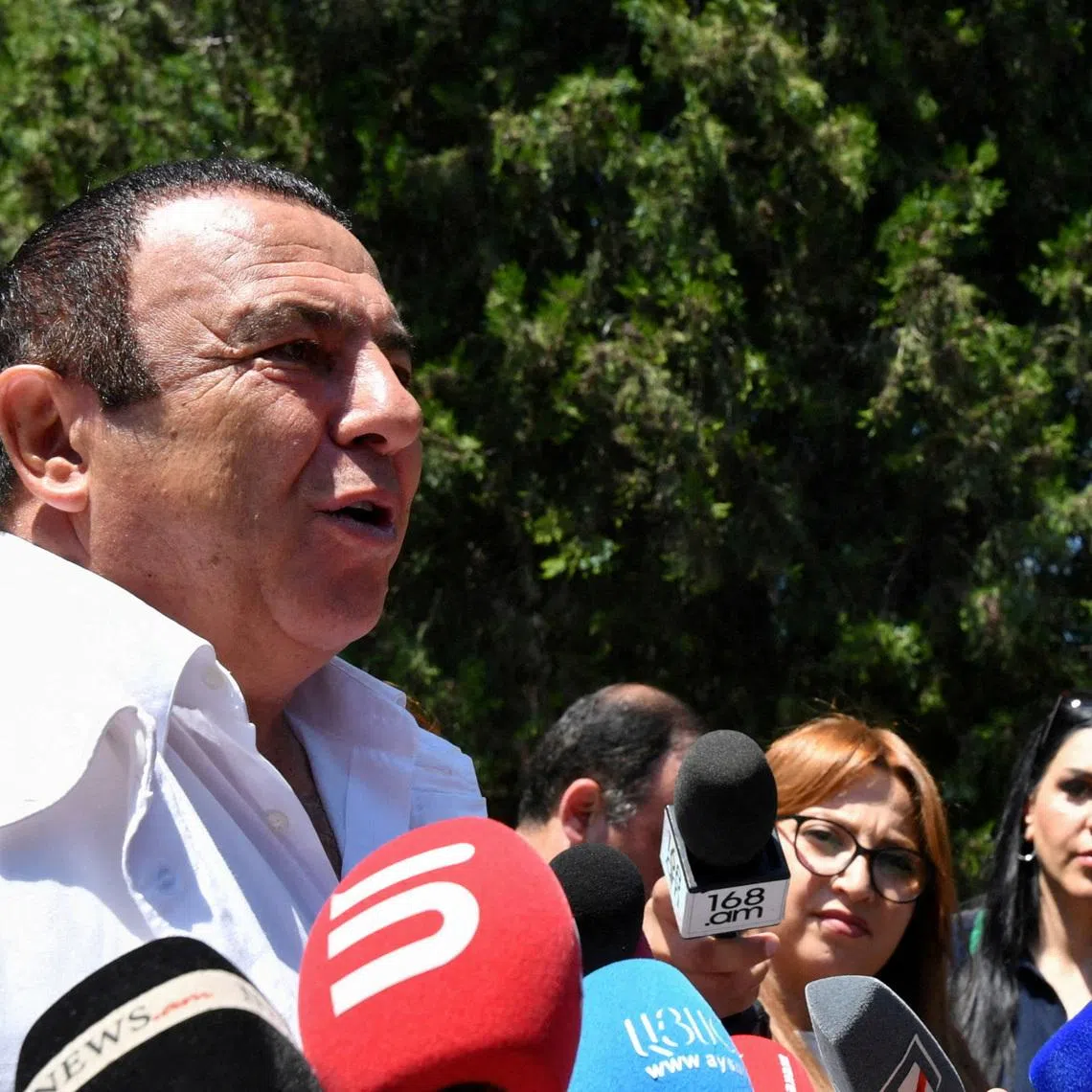 FILE PHOTO: Leader of the Prosperous Armenia party Gagik Tsarukyan speaks with journalists near a polling station during a parliamentary election in the village of Arinj outside Yerevan, Armenia, June 7, 2026. Stringer/Photolure via REUTERS/File Photo