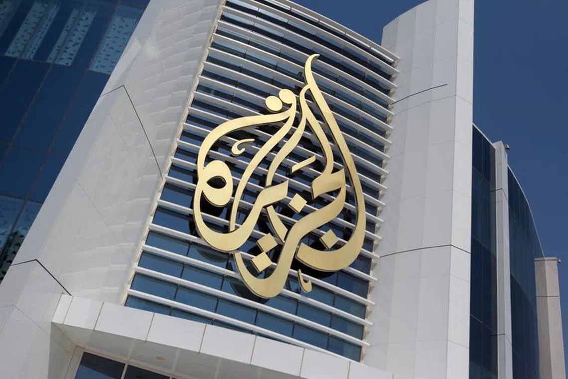The logo of Al Jazeera Media Network is seen on its headquarters building in Doha, Qatar June 8, 2017. REUTERS/Naseem Zeitoon/ File Photo