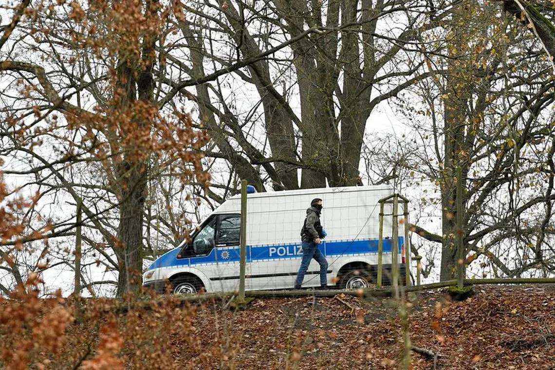 FILE PHOTO: Police secure the area around the Waidmannsheil hunting lodge, after suspected members and supporters of a far-right group were detained during raids across Germany, in Saaldorf, Bad Lobenstein, Germany December 8, 2022. REUTERS/Matthias Rietschel/File Photo