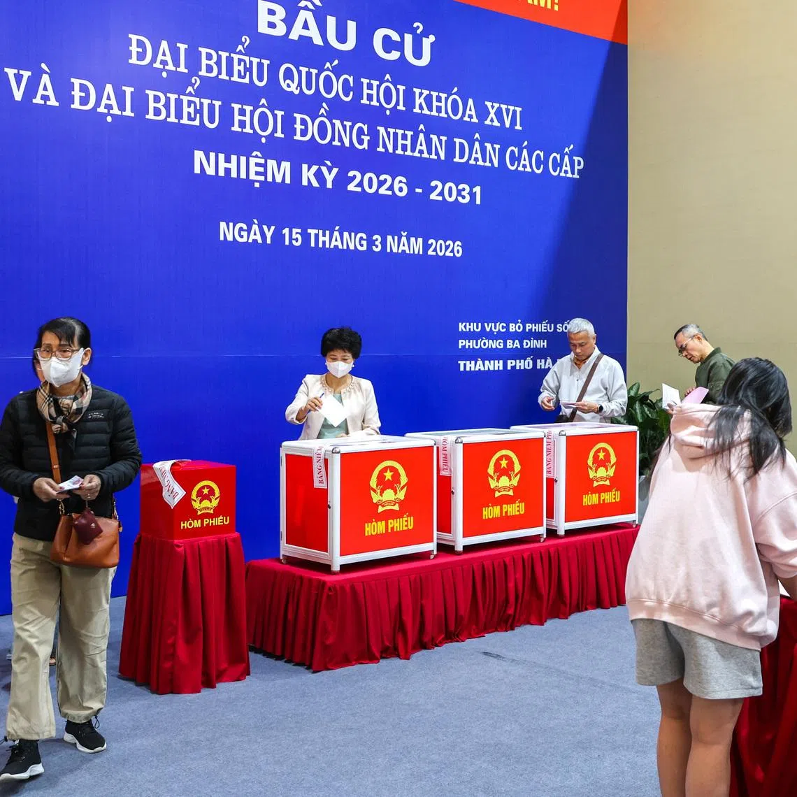 People vote at a polling station during a parliamentary election, in Hanoi, Vietnam, March 15, 2026.
