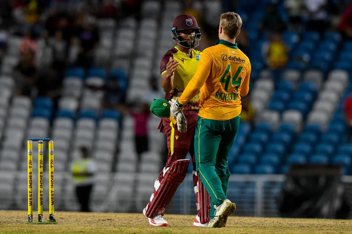 Ryan Rickelton of South Africa congratulates Shai Hope for West Indies winning the 3rd and final T20I match at Brian Lara Cricket Academy in Tarouba, Trinidad and Tobago on Aug 27, 2024.