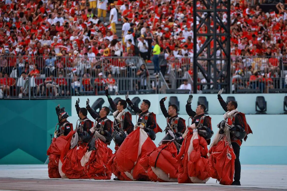 Red Lions waving at spectators after completing their descent during the National Day Parade (NDP) at the Padang on Aug 9, 2023. ST PHOTO: KEVIN LIM