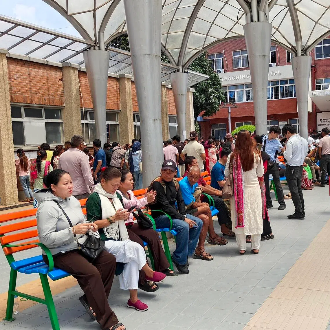 People waiting outside Kathmandu’s Tribhuvan University Teaching Hospital, one of the city’s two major public hospitals where the dead as well as injured are being brought, on Aug 28.