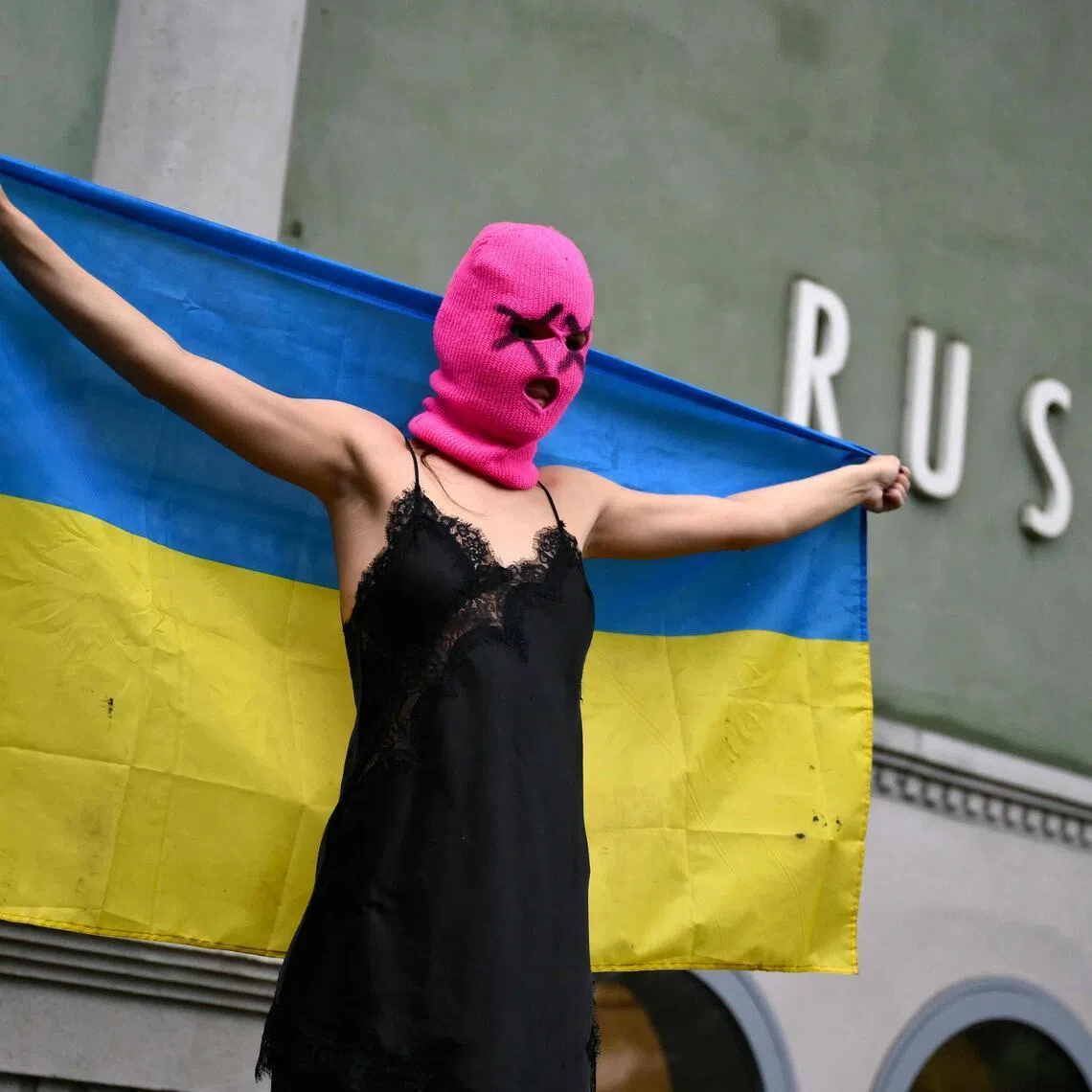 An activist holding a Ukrainian flag protesting on May 6 in front of the Russia pavilion at the Venice Biennale art show.