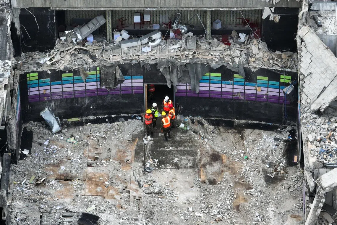 A drone view shows emergency personnel at the site of the collapsed Jet Set nightclub, in Santo Domingo, Dominican Republic, April 10, 2025. REUTERS/Ricardo Arduengo