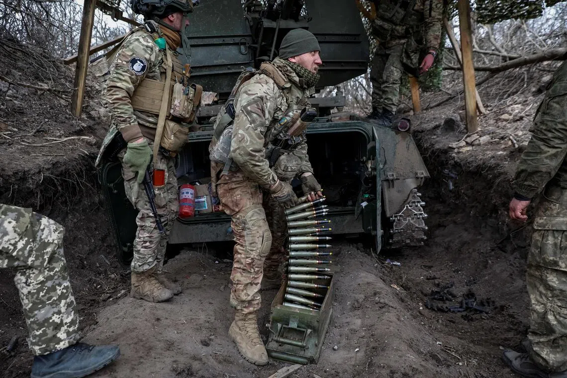 Ukrainian servicemen operate an anti-aircraft cannon near the Ukrainian town of Bakhmut.