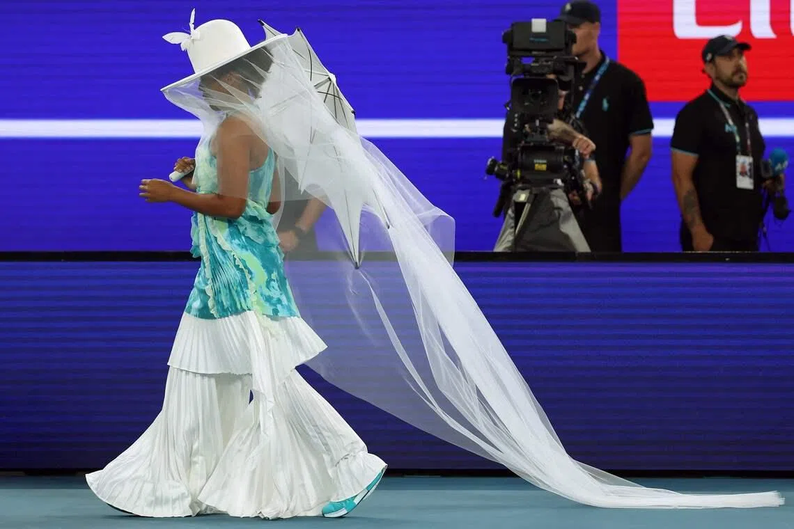 Japan's Naomi Osaka walking on the court to play against Croatia's Antonia Ruzic during their women's singles match on day three of the Australian Open tennis tournament in Melbourne, Australia on Jan 20, 2026. 