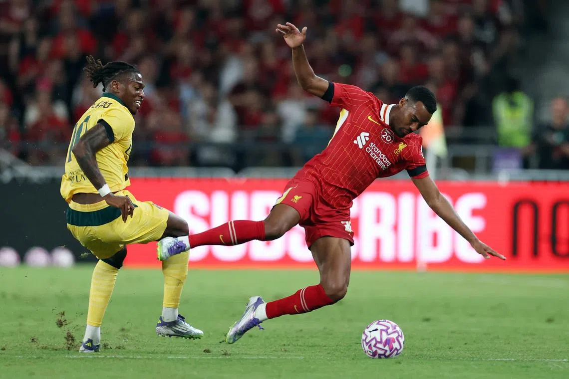 Soccer Football - Pre-Season Friendly - Liverpool v AC Milan - Kai Tak Sports Park, Hong Kong, China - July 26, 2025 AC Milan's Rafael Leao in action with Liverpool's Ryan Gravenberch REUTERS/Tyrone Siu