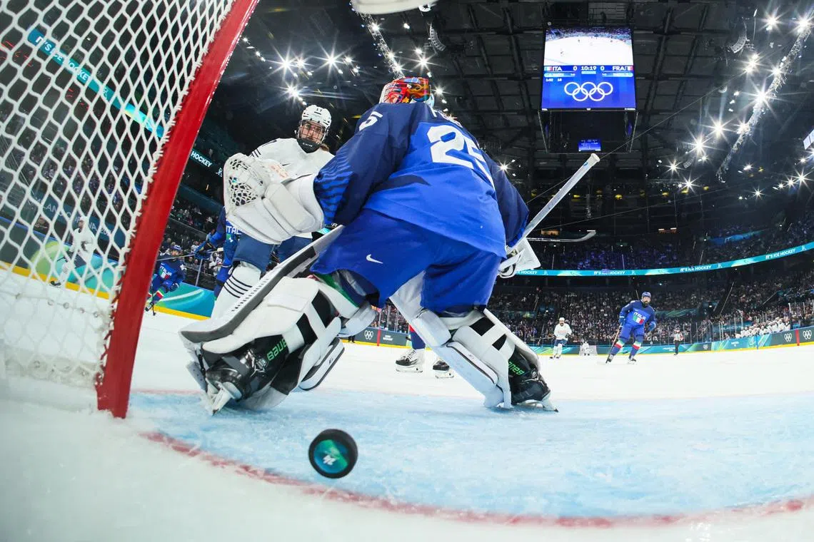 Milano Cortina 2026 Olympics - Ice Hockey - Women's Preliminary Round - Group B - Italy vs France - Milano Santagiulia Ice Hockey Arena, Milan, Italy - February 05, 2026. Martina Fedel of Italy in action as France's first goal is scored by Gabrielle de Serres of France REUTERS/Gregory Shamus
