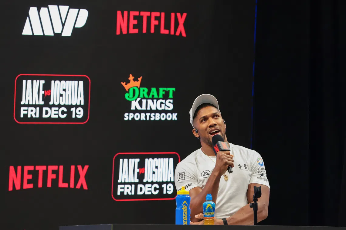 Nov 21, 2025; Miami, Florida, UNITED STATES; Anthony Joshua speaks to reporters during a press conference announcing his heavyweight boxing match against Jake Paul at Kayesa Center. Mandatory Credit: Sam Navarro-Imagn Images