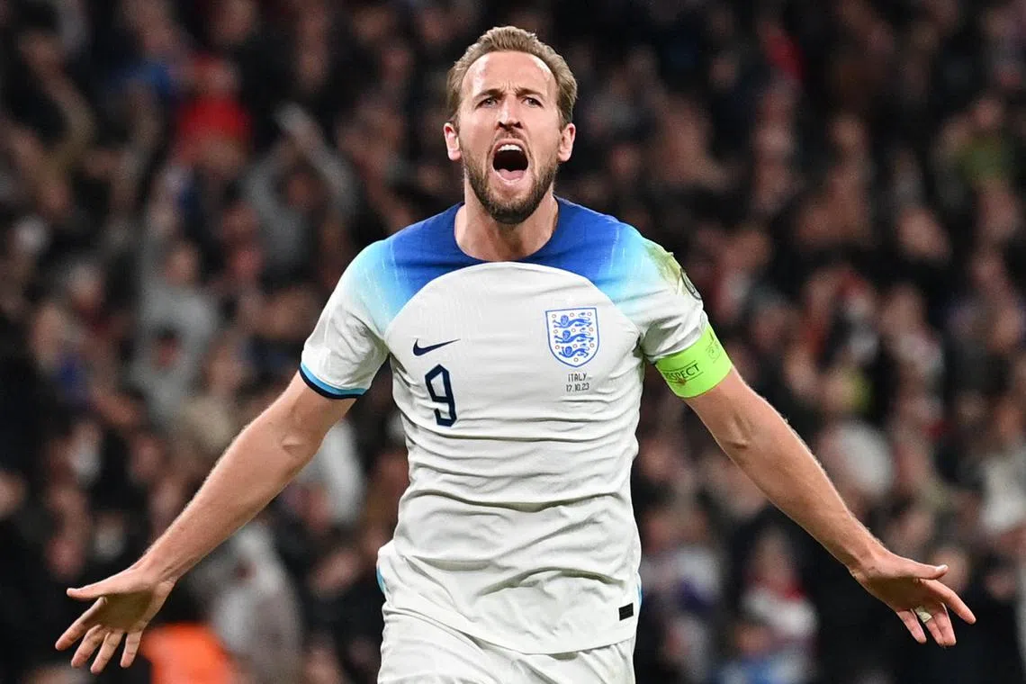 England striker Harry Kane celebrates after scoring his team's third goal.