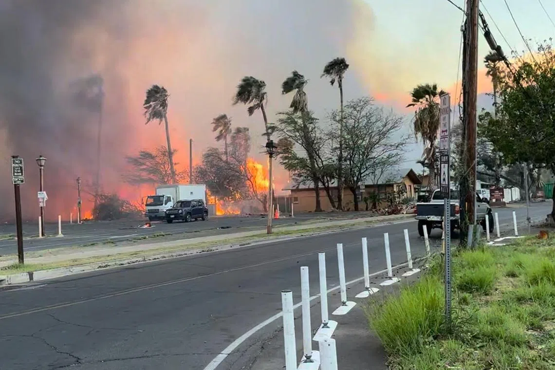 Smoke and flames rise in Lahaina, Maui County, Hawaii, U.S., August 8, 2023 in this still image from video obtained from social media. Jeff Melichar/TMX/via REUTERS  THIS IMAGE HAS BEEN SUPPLIED BY A THIRD PARTY. MANDATORY CREDIT. NO RESALES. NO ARCHIVES.