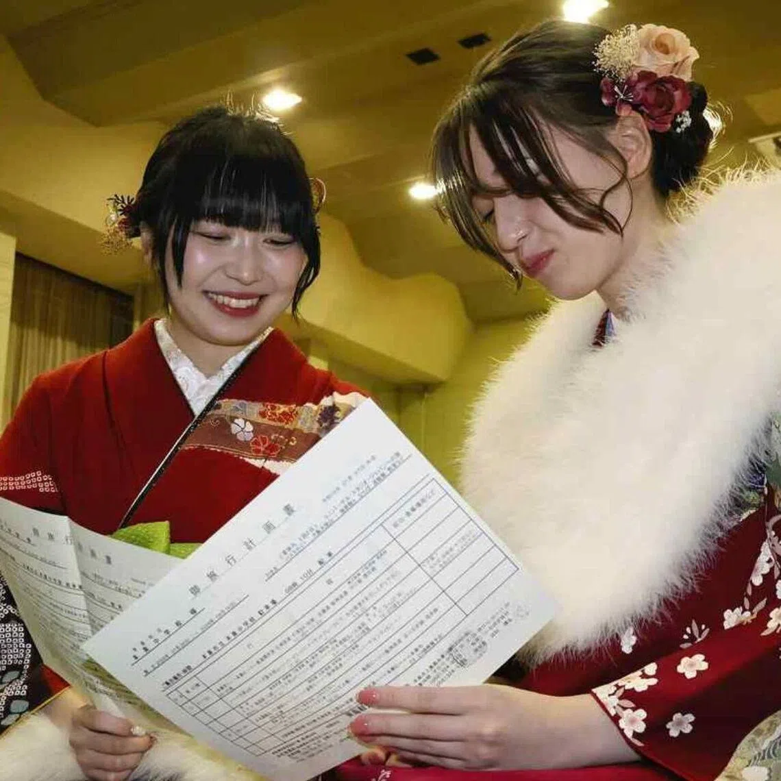 Former classmates discuss plans for their delayed school trip, after the coming-of-age ceremony in Motosu, Gifu prefecture, on Jan 11.