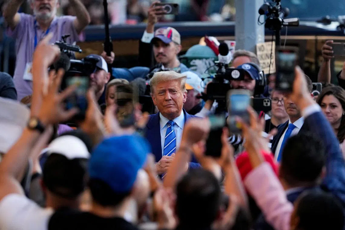 FILE PHOTO: Republican presidential candidate and former U.S. President Donald Trump holds a campaign stop at Sanaa convenient store, in the Harlem section of New York City, U.S., April 16, 2024. REUTERS/Adam Gray/File Photo