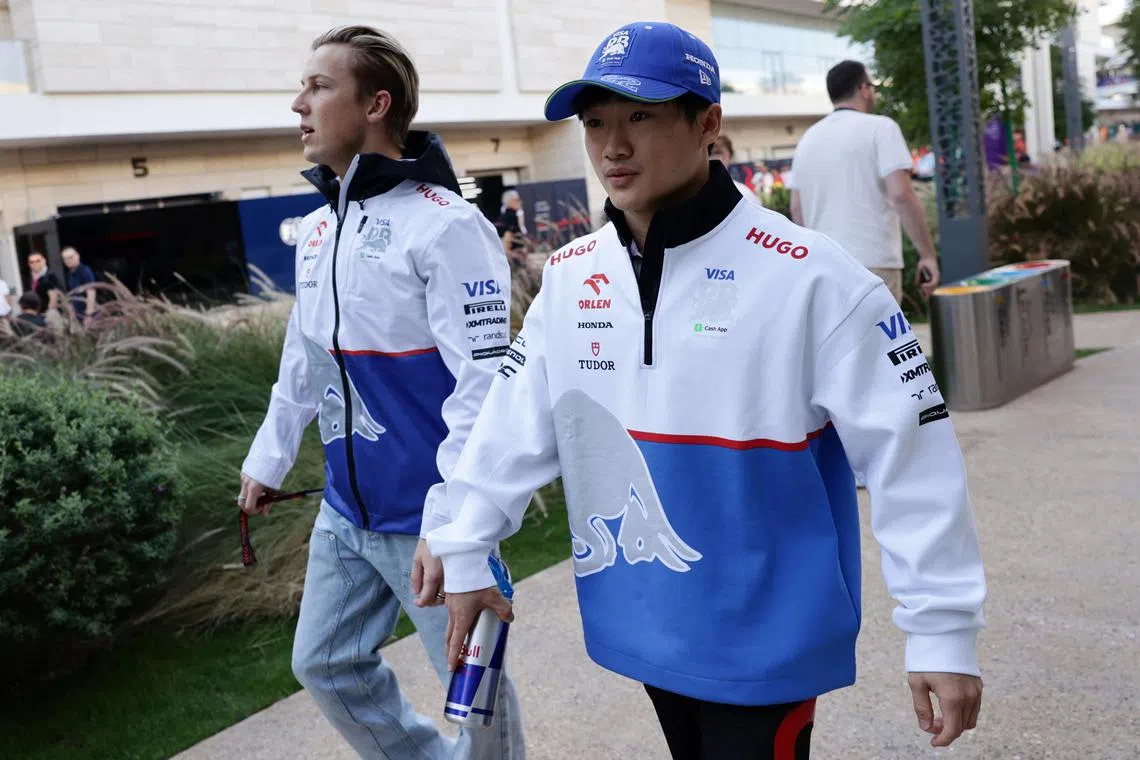 FILE PHOTO: Formula One F1 - Qatar Grand Prix - Lusail International Circuit, Lusail, Qatar - November 29, 2024 RB's Yuki Tsunoda and Liam Lawson before practice REUTERS/Jakub Porzycki/File Photo