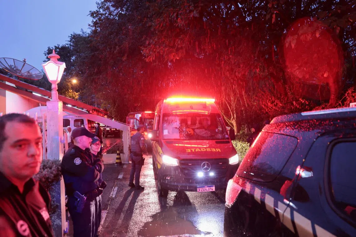 Authorities arrive at the site of a turboprop plane crash where all passengers and crew onboard died, in Vinhedo, Brazil, on Aug 9.