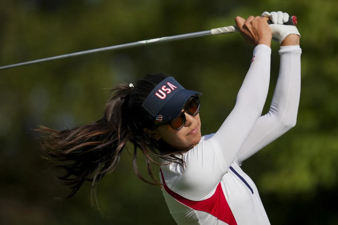 FILE PHOTO: Sep 15, 2024; Gainesville, Virginia, USA; Alison Lee of Team USA plays her shot from the third tee during single matches against Team Europe during the Solheim Cup 2024 at Robert Trent Jones Golf Club. Mandatory Credit: Aaron Doster-Imagn Images/File Photo