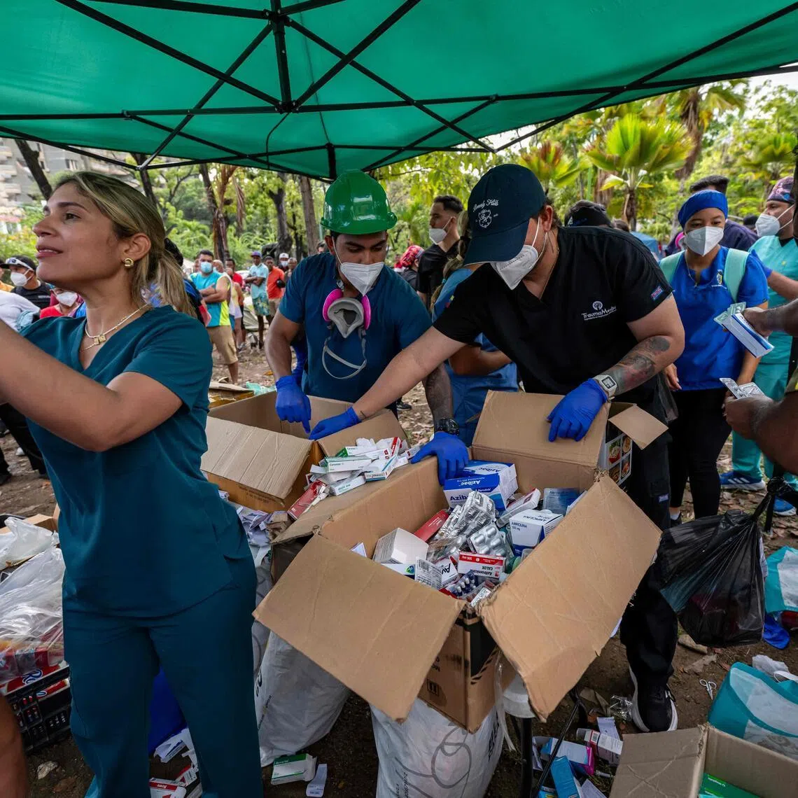 Medical staff and students classify medicines to distribute to displaced people in Caraballeda, La Guaira state, Venezuela.