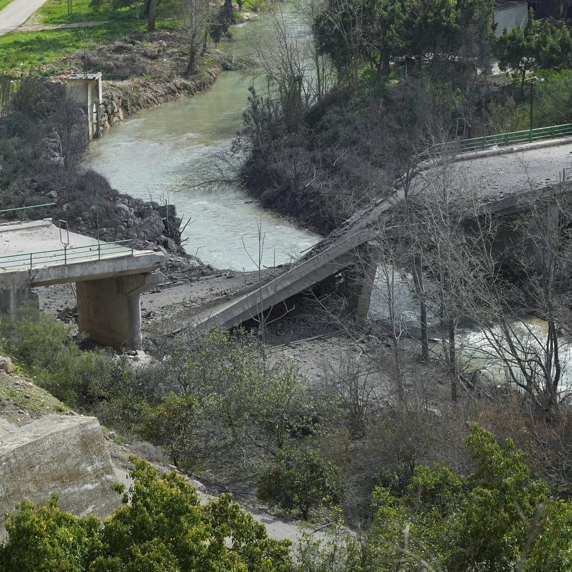 The damaged Zrarieh Bridge over the Litani river, after it was hit by an Israeli strike in Tayr Falsay in southern Lebanon, following an escalation between Hezbollah and Israel amid the U.S.-Israeli conflict with Iran, Lebanon, March 13, 2026. REUTERS/ Stringer