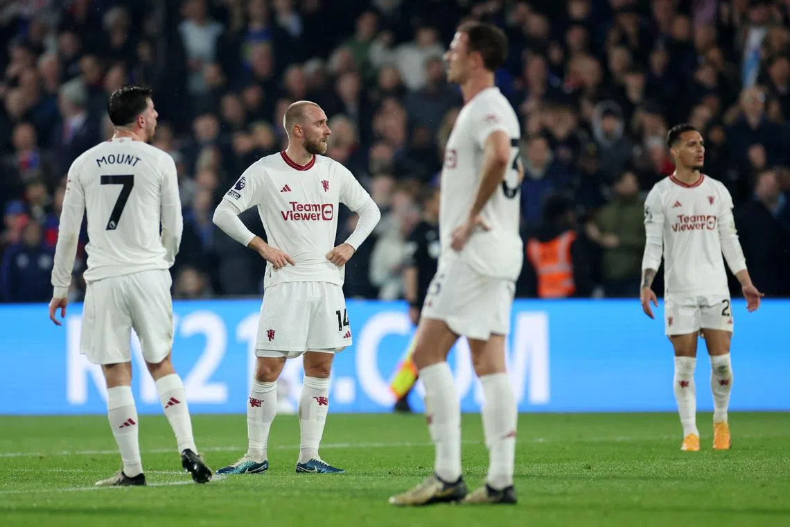 Manchester United's Christian Eriksen and teammates look dejected after Crystal Palace's Jean-Philippe Mateta scores their second goal..