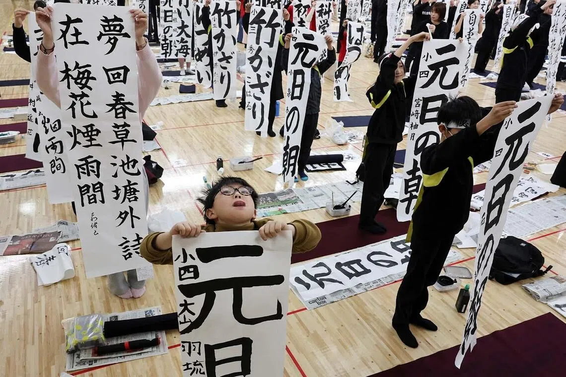 Participants show their writings during the annual New Year calligraphy contest with more than 2,000 participants, at Nippon Budokan in Tokyo, Japan, January 5, 2026. REUTERS/Kim Kyung-Hoon