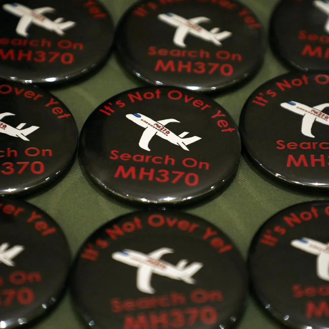 Badges are displayed during the sixth annual remembrance event for the missing Malaysia Airlines flight MH370 in Putrajaya, Malaysia, on March 7, 2020.