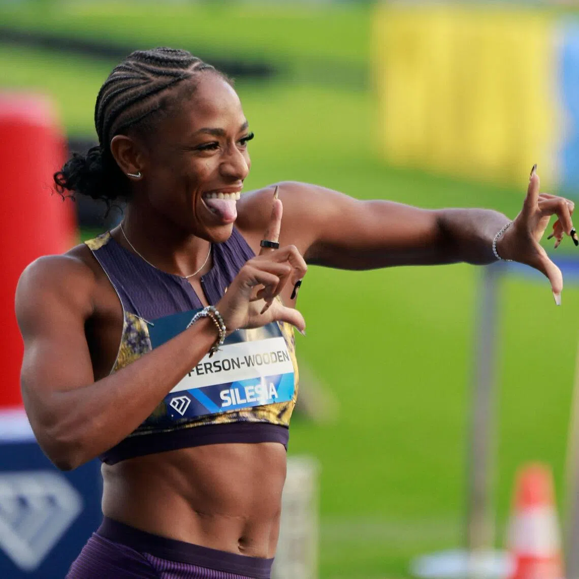 American Melissa Jefferson-Wooden celebrates in front of the cameras after winning the women’s 100 m at the Silesia Diamond League athletics meet in Poland on Aug 23.