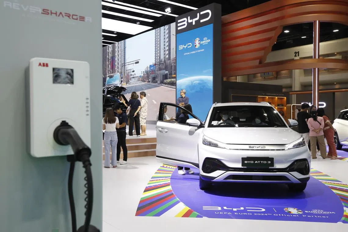 Visitors inspect Chinese automaker BYD's Atto 3 electric car displayed at the 45th Bangkok International Motor Show 2024  in Nonthaburi province on the outskirts of Bangkok, Thailand.