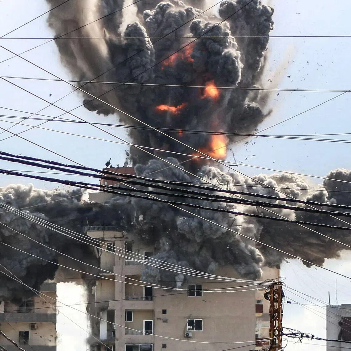 A fireball rising from a building hit by an Israeli airstrike in the area of Abbasiyeh, on the outskirts of the southern Lebanese city of Tyre, on April 8, 2026. 