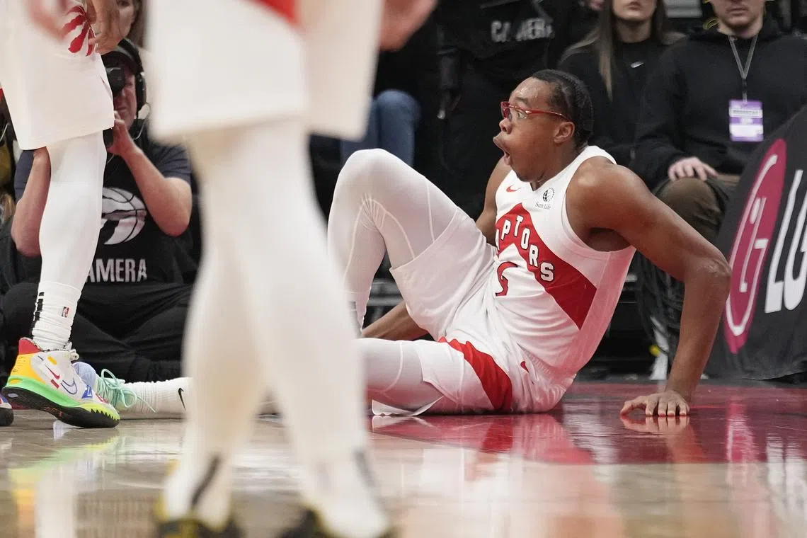 Dec 9, 2024; Toronto, Ontario, CAN; Toronto Raptors forward Scottie Barnes (4) reacts after injuring his leg during the second half against the New York Knicks at Scotiabank Arena. Mandatory Credit: John E. Sokolowski-Imagn Images/ File Photo