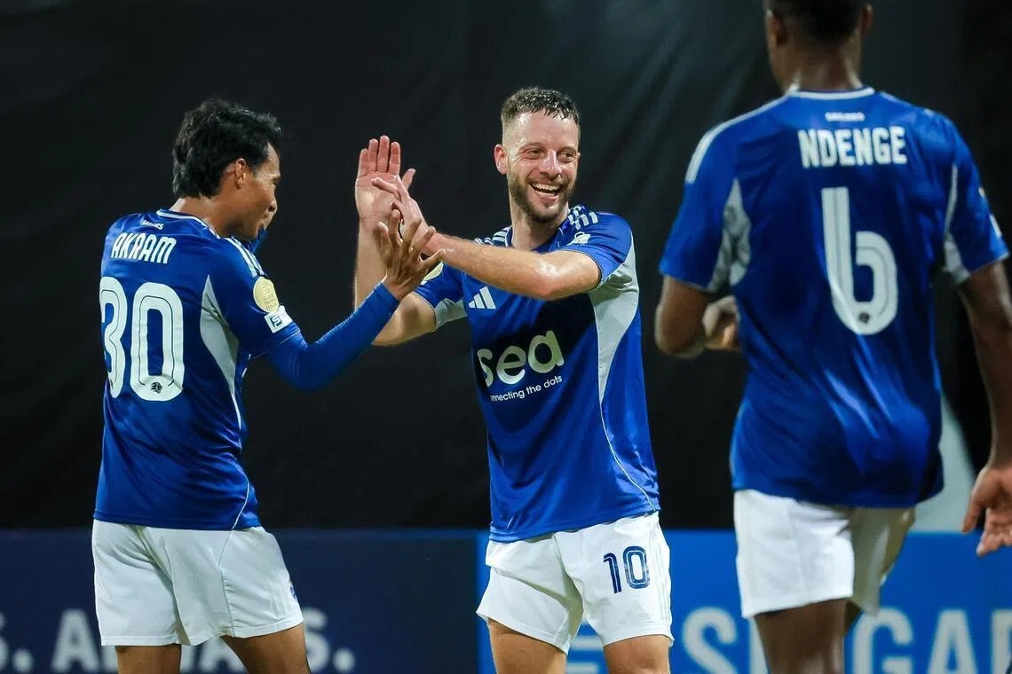 Lion City Sailors attacker Bart Ramselaar (centre) celebrates with Akram Azman (left) and Tsiy-William Ndenge after scoring in a 5-1 Singapore Premier League win against Hougang United at Bishan Stadium.