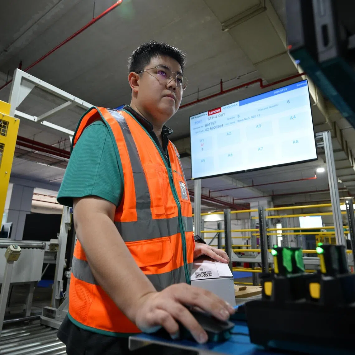 Frederick Wong, senior executive at ST Logistics, has learnt to manage new software and troubleshoot robotic equipment as the warehouse he works in adopts automation.