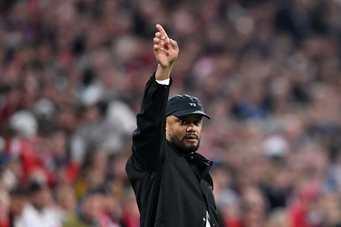 Soccer Football - Bundesliga - Bayern Munich v Werder Bremen - Allianz Arena, Munich, Germany - September 26, 2025 Bayern Munich coach Vincent Kompany celebrates after the match REUTERS/Angelika Warmuth