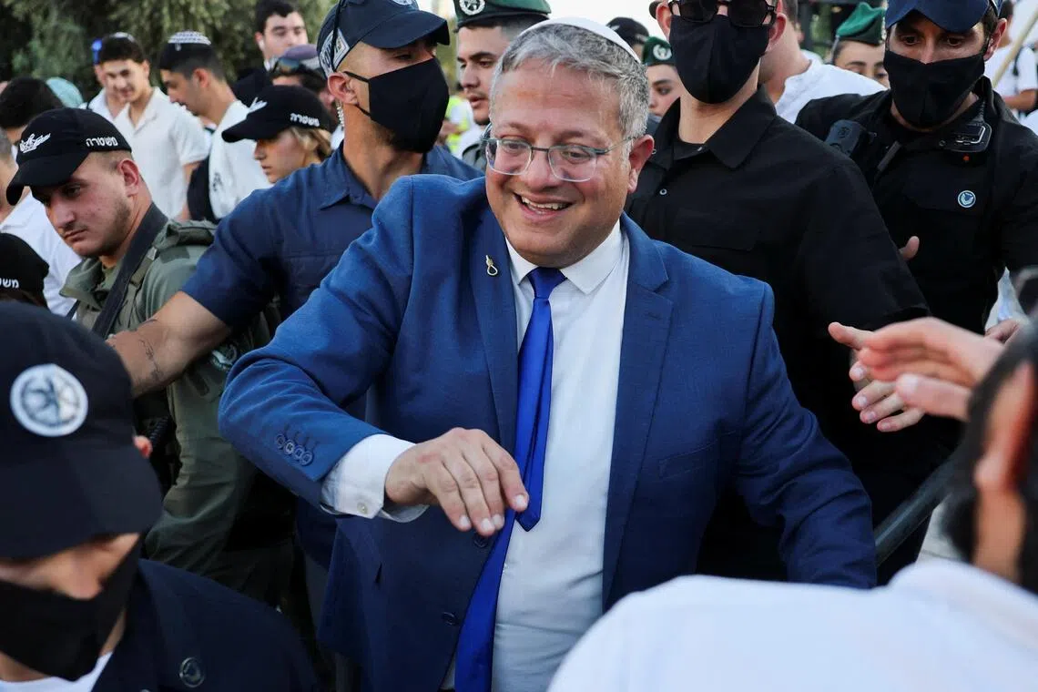In the video shared by Mr Itamar Ben Gvir, he is seen encouraging staff at the detention centre as they push down an activist who had stood up to say “free free Palestine” as he walked by.