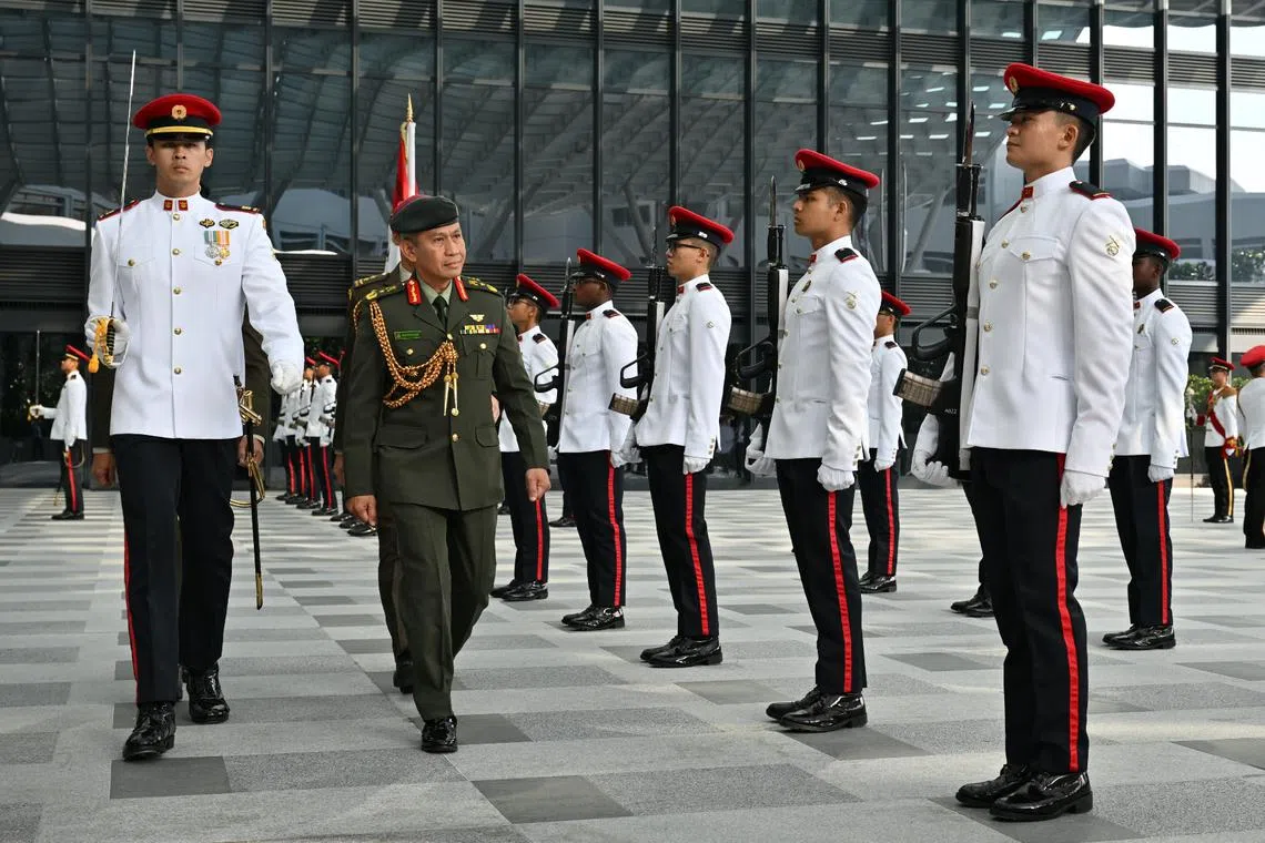BG Shannonizam (second from left) inspecting the Guard of Honour at Mindef on April 23.
