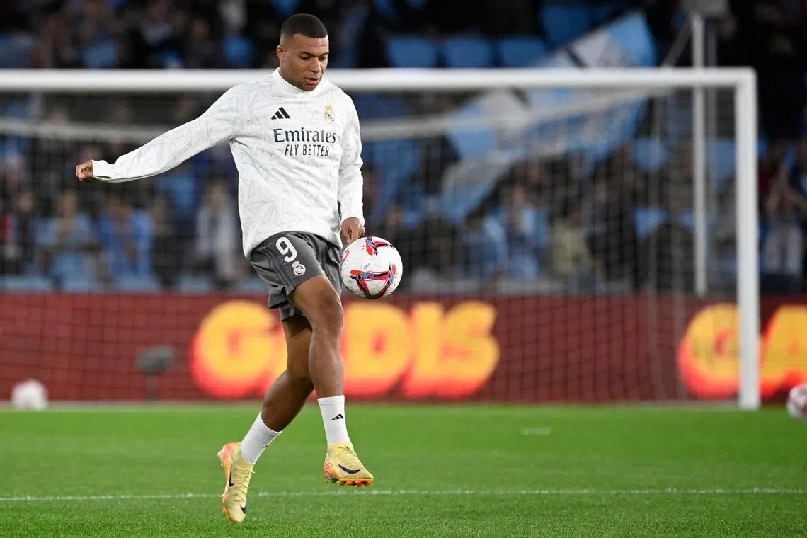 Real Madrid's French forward Kylian Mbappe warms up before the match between RC Celta de Vigo and Real Madrid CF.