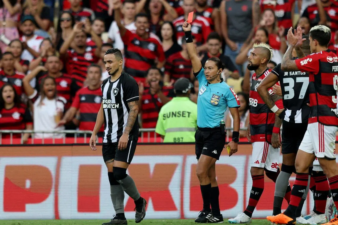 FILE PHOTO: Soccer Football - Brasileiro Championship - Flamengo v Botafogo - Estadio Maracana, Rio de Janeiro, Brazil - April 30, 2023 Botafogo's Rafael is shown a red card by referee Edina Alves Batista REUTERS/Sergio Moraes/File Photo