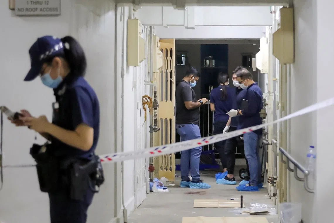 Police at the scene in Bendemeer Road, where Ng Eng Kui was shot in the chest by police on 23 March 2022. He had continued to advance towards police officers with a knife after they fired three Taser shots at him.