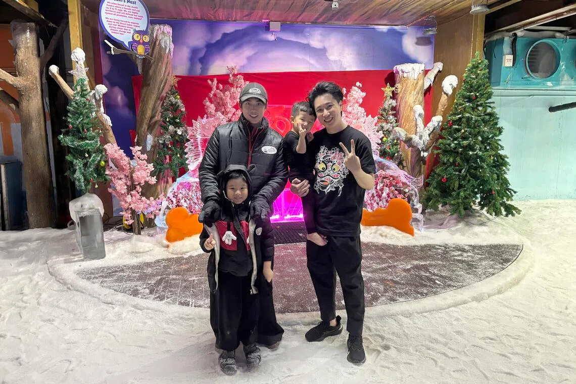 Singapore actors Yang Yan (left) and Dasmond Koh with Mr Koh's grandnephews at Snow City on May 20.