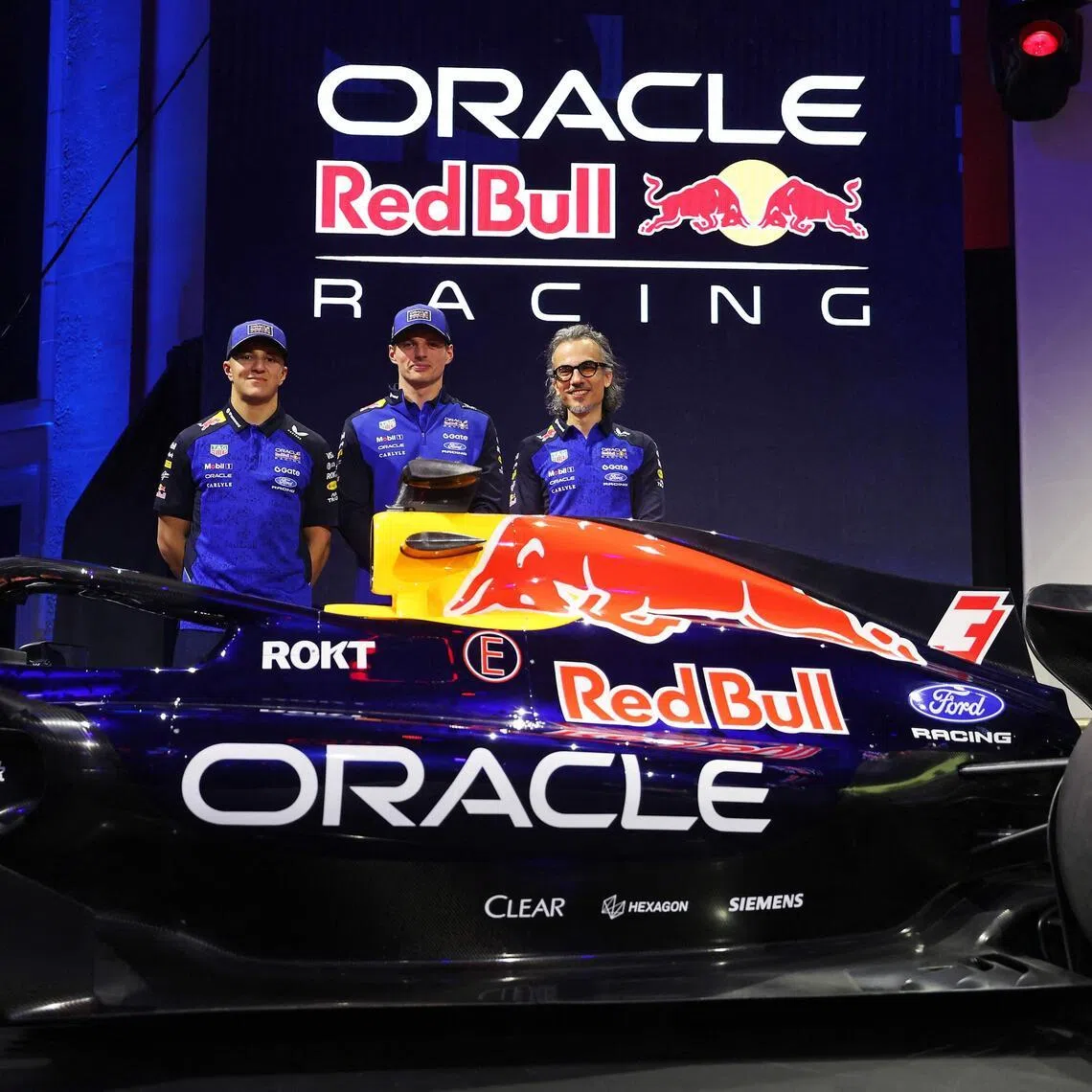 Red Bull drivers Isack Hadjar, Max Verstappen and team principal Laurent Mekies during the Red Bull Racing season launch at Michigan Central Station.