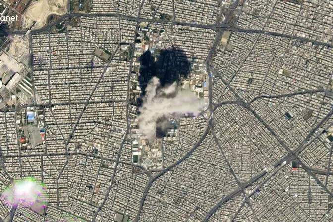 A handout satellite image taken on March 1, 2026 shows a smoke plume billowing from Tehran's District 7 area.