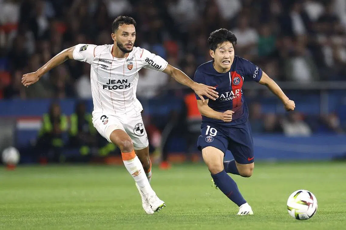 FILE PHOTO: Soccer Football - Ligue 1 - Paris St Germain v Lorient - Parc des Princes, Paris, France - August 12, 2023  Lorient's Montassar Talbi in action with Paris St Germain's Lee Kang-in REUTERS/Christian Hartmann/File Photo