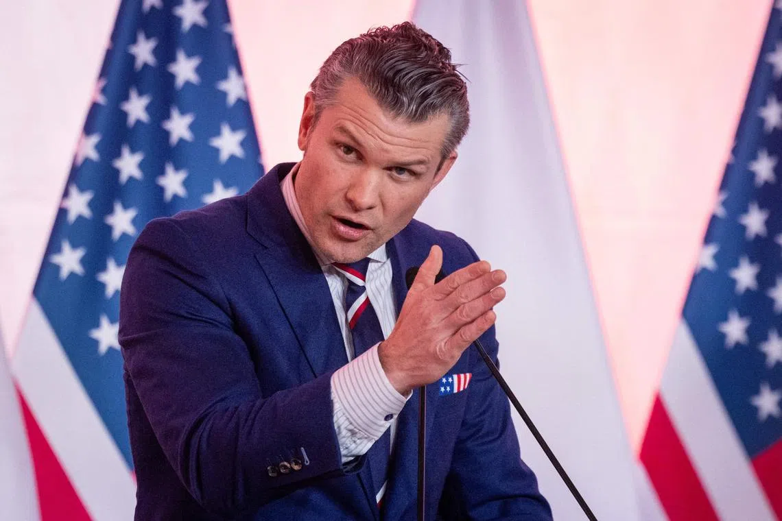 (FILES) US Defence Secretary Pete Hegseth speaks during join press conference with Poland's Defence Minister after their meeting at the Ministry of Defence headquarters in Warsaw on February 14, 2025. The Trump administration has ordered senior US military leaders to plan for expansive cuts that could slash the defense budget by eight percent annually, or some $290 billion within the next five years, US media reported February 19, 2025. Defense Secretary Pete Hegseth told the Pentagon to develop the deep reductions, The Washington Post reported, citing a memo. (Photo by Wojtek RADWANSKI / AFP)