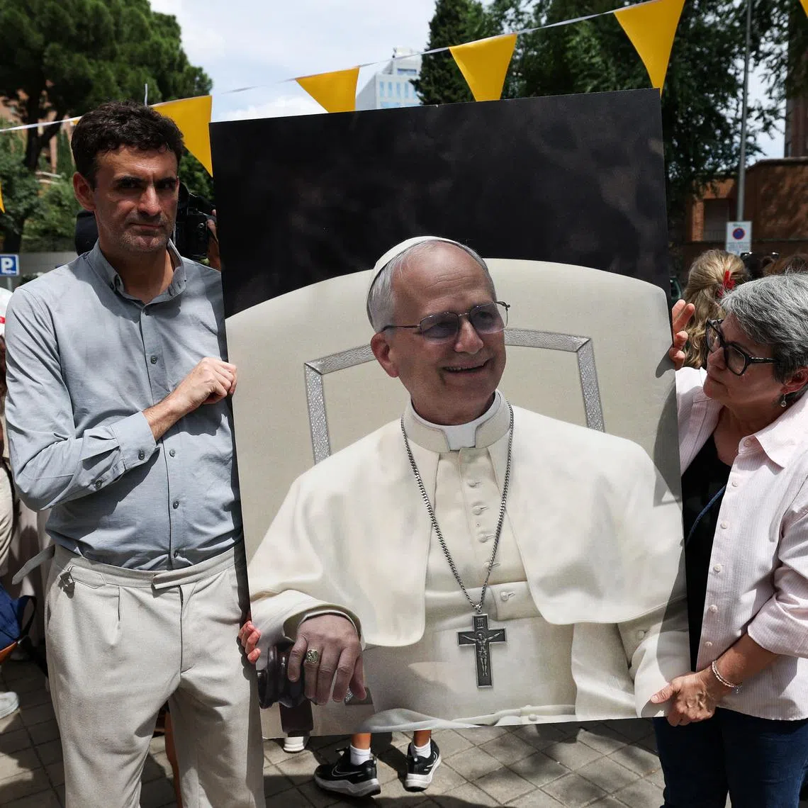 Miguel Hurtado, who alleges abuse by a priest at Montserrat Abbey and is a representative for the platform \"Full Reparation Now\" to support victims of sexual abuse in the Catholic Church, and Maria Dantas hold a placard with a picture of Pope Leo XIV, during a protest for victims of clerical sexual abuse in front of the Apostolic Nunciature, where Pope is staying during his apostolic journey in Spain, in Madrid, Spain June 7, 2026. REUTERS/Violeta Santos Moura