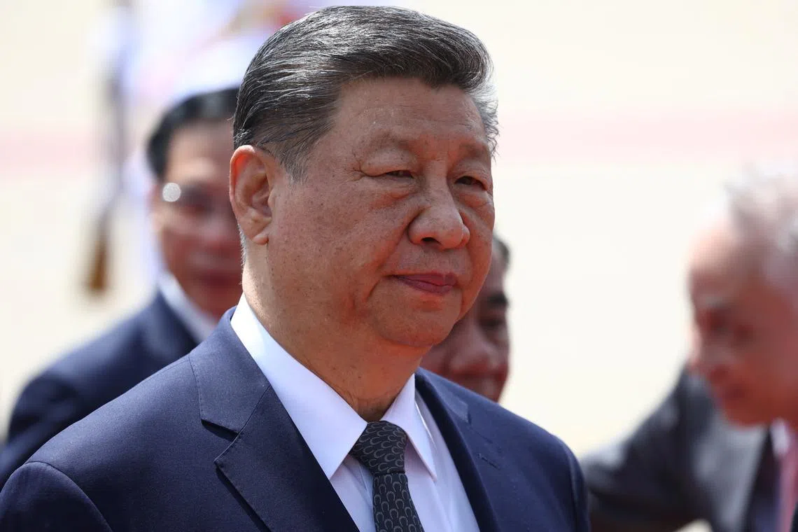 FILE PHOTO: Chinese President Xi Jinping looks on on the day he lays a wreath at the Ho Chi Minh Mausoleum during his visit to Hanoi, Vietnam, April 15, 2025. REUTERS/Athit Perawongmetha/Pool/File Photo