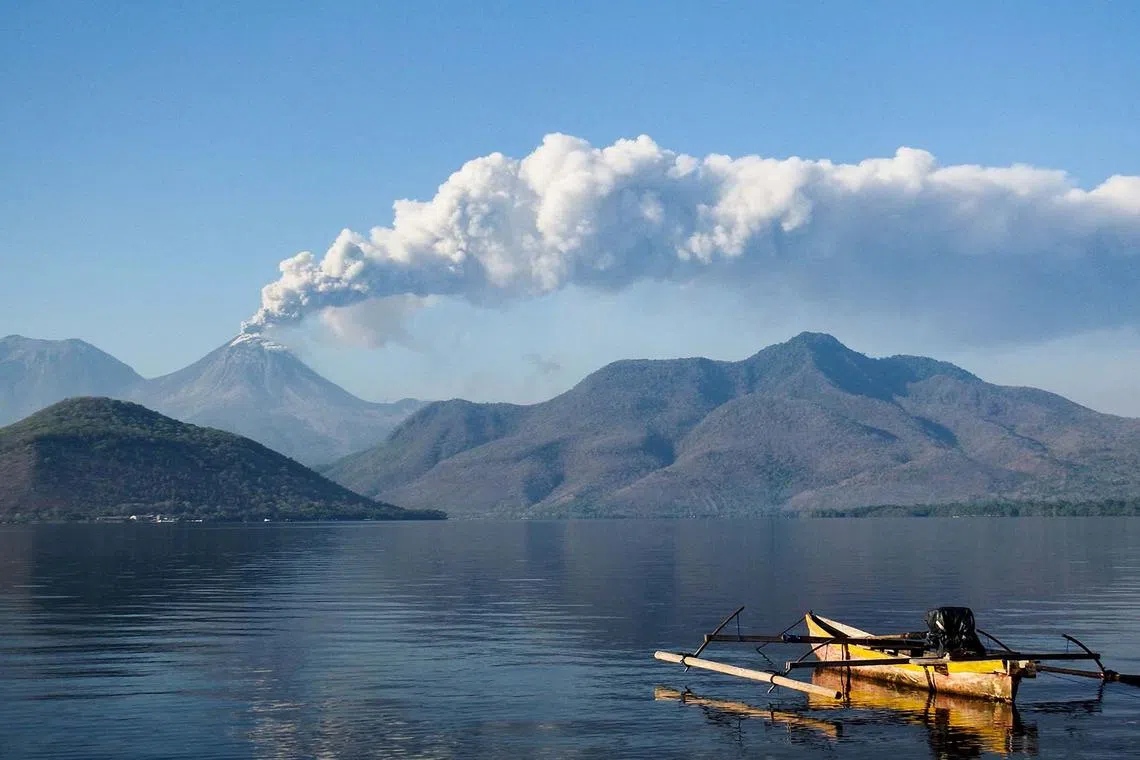 Mount Lewotobi Laki-Laki spewing ash and smoke during an eruption as seen from Lewolaga village in Titihena, East Nusa Tenggara, Indonesia, on Nov 13, 2024. 