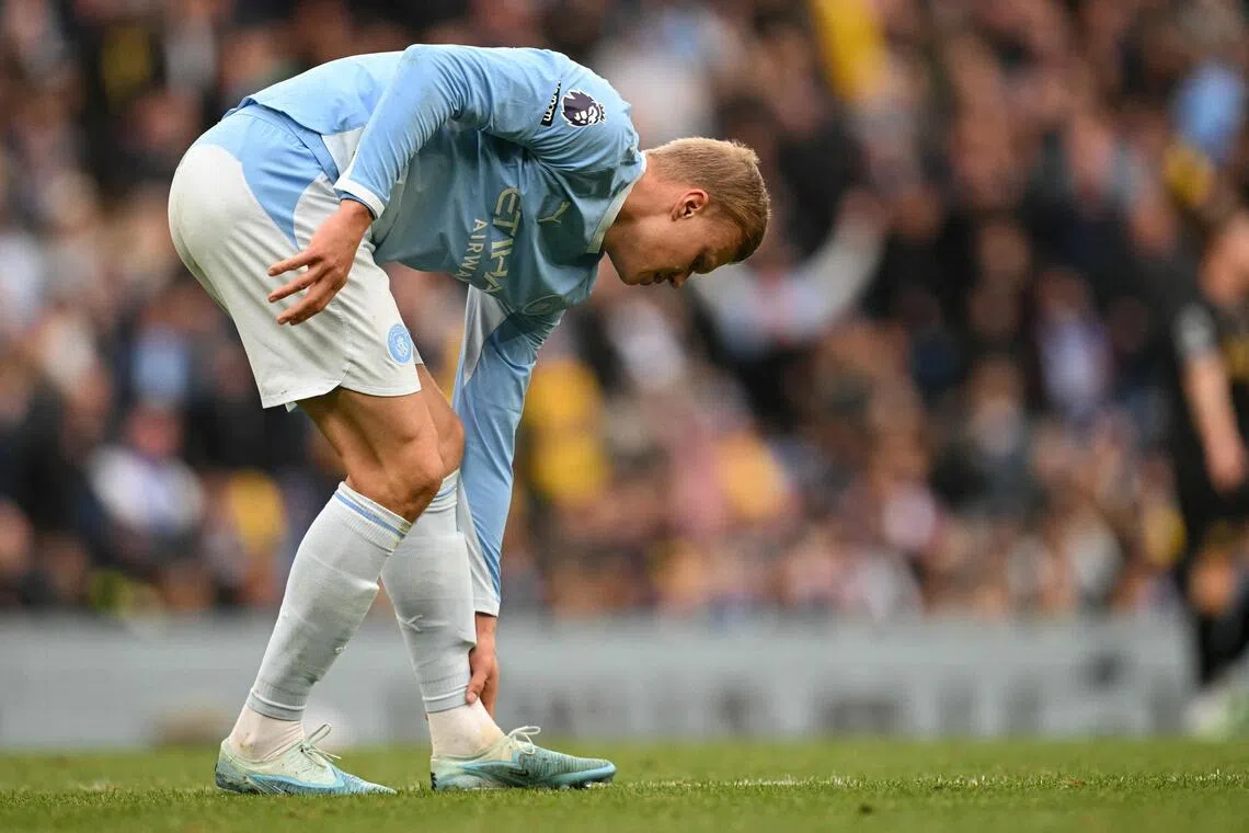 Manchester City’s Erling Haaland holding his leg after vying for the ball with Ipswich Town’s Jack Clarke during the Cityzens’ 3-2 win in an EPL match on Oct 17.