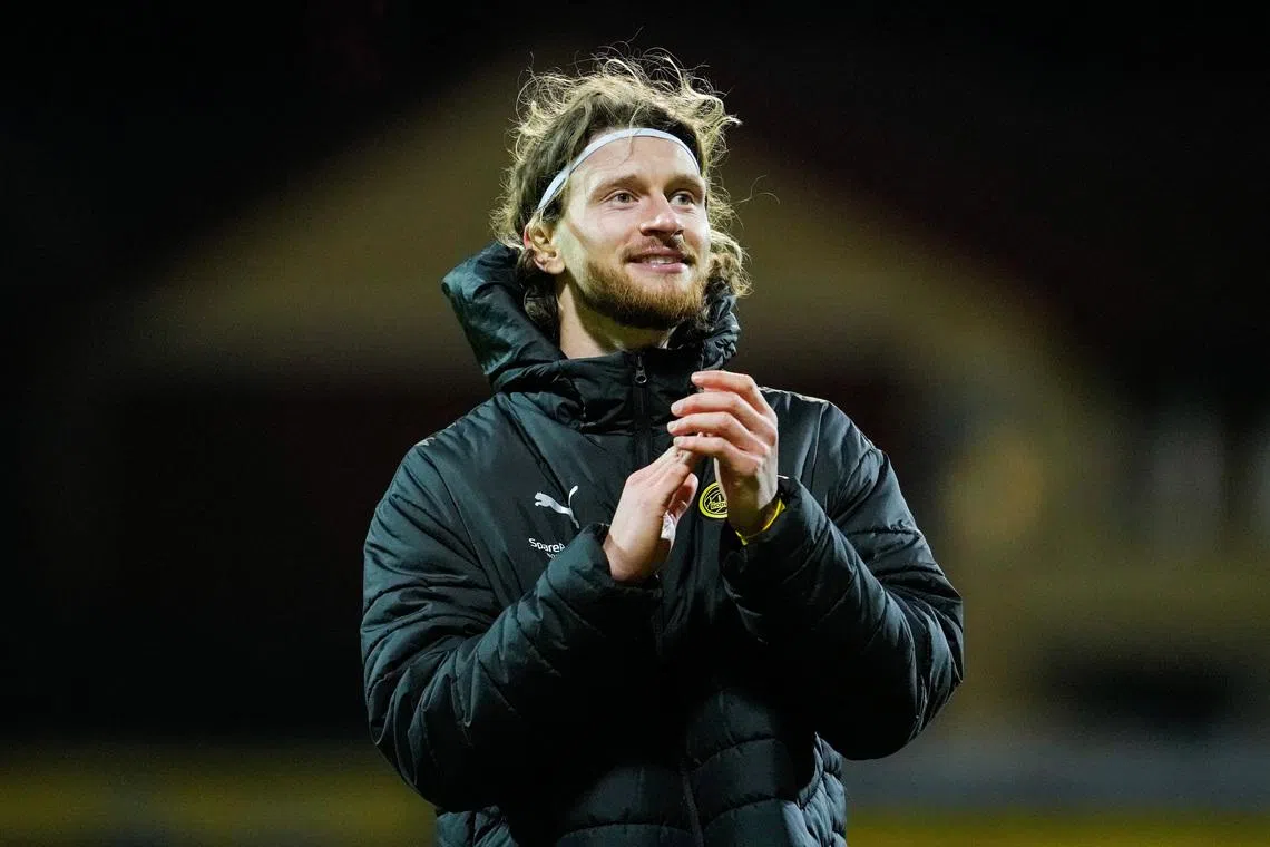 Soccer - UEFA Champions League - Round of 16 - First Leg - Bodo/Glimt v Sporting CP - Aspmyra Stadion, Bodo, Norway - March 11, 2026 Bodo/Glimt's Kasper Hogh applauds fans after the match Fredrik Varfjell/NTB via REUTERS