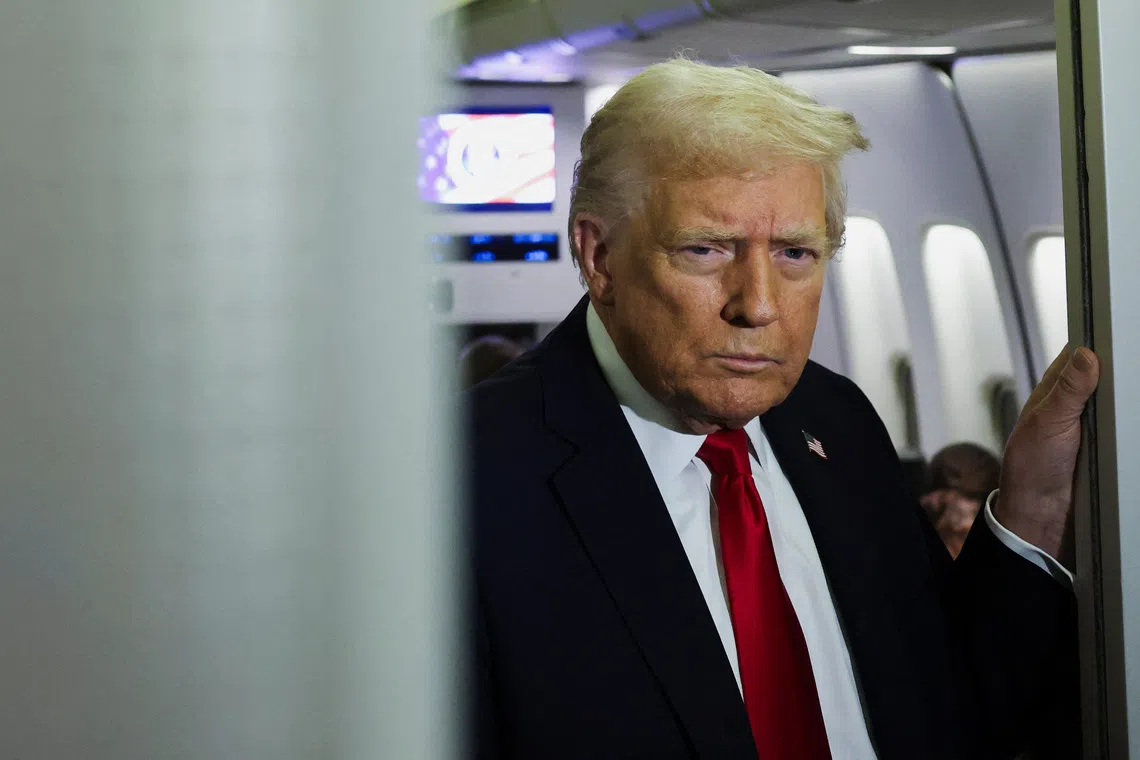 U.S. President Donald Trump looks on aboard Air Force One during travel to Palm Beach, Florida, from Joint Base Andrews, Maryland, U.S., November 25, 2025. REUTERS/Anna Rose Layden